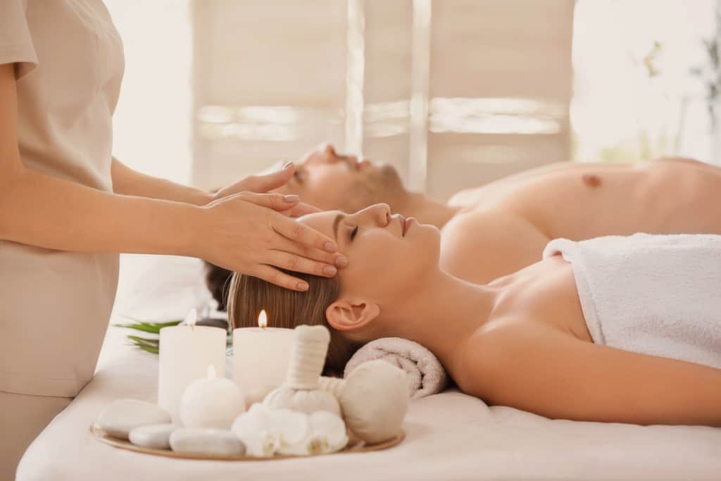 Young couple having massage in spa salon